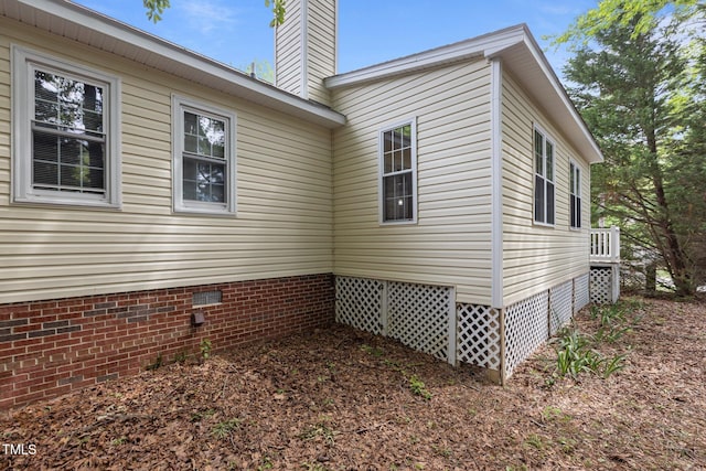 4705 Forest Highland Dr, Raleigh, NC 27604 - view of home's exterior with crawl space and a chimney