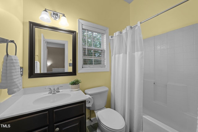 bathroom featuring toilet, vanity, and shower / bath combination with curtain