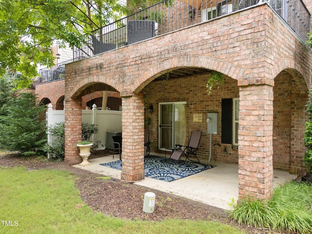 view of patio / terrace featuring central AC unit and a balcony