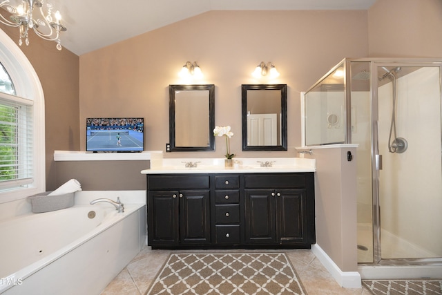 full bath with vaulted ceiling, double vanity, a garden tub, a stall shower, and tile patterned flooring
