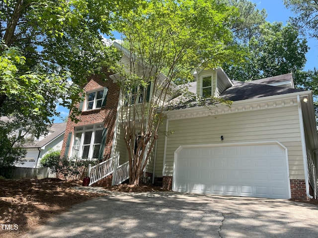 8100 Laurel Mountain Rd, Raleigh, NC 27613 - view of front of home featuring driveway and an attached garage