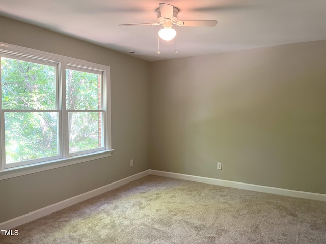 8100 Laurel Mountain Rd, Raleigh, NC 27613 - empty room featuring light carpet and ceiling fan
