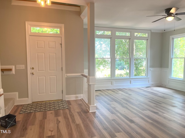 8100 Laurel Mountain Rd, Raleigh, NC 27613 - foyer with wood finished floors, a wainscoted wall, and ceiling fan