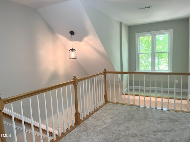 8100 Laurel Mountain Rd, Raleigh, NC 27613 - hallway featuring carpet floors and vaulted ceiling
