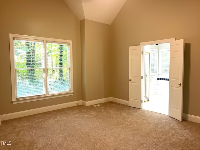 8100 Laurel Mountain Rd, Raleigh, NC 27613 - empty room with carpet floors and lofted ceiling