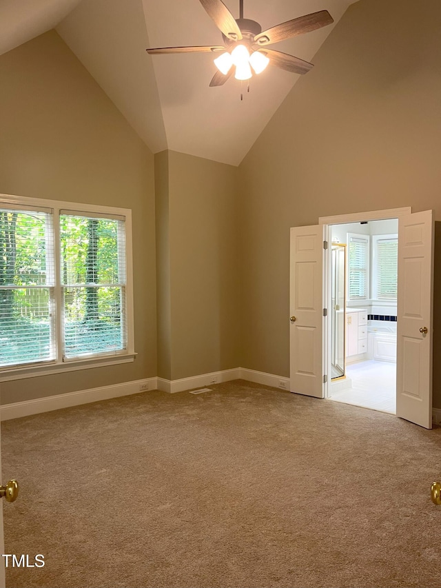 8100 Laurel Mountain Rd, Raleigh, NC 27613 - carpeted empty room with high vaulted ceiling and a ceiling fan