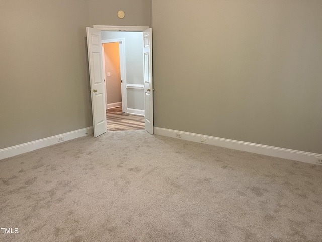 8100 Laurel Mountain Rd, Raleigh, NC 27613 - carpeted spare room with baseboards and a smoke detector