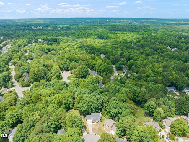drone / aerial view of a heavily wooded area
