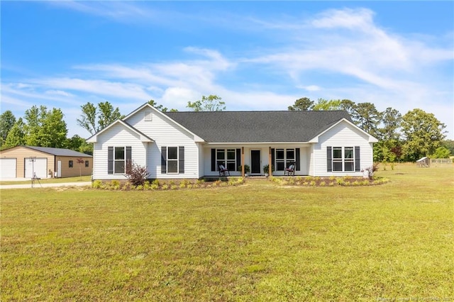 6955 S W St, Godwin, NC 28344 - single story home featuring covered porch, a garage, an outdoor structure, and a front yard