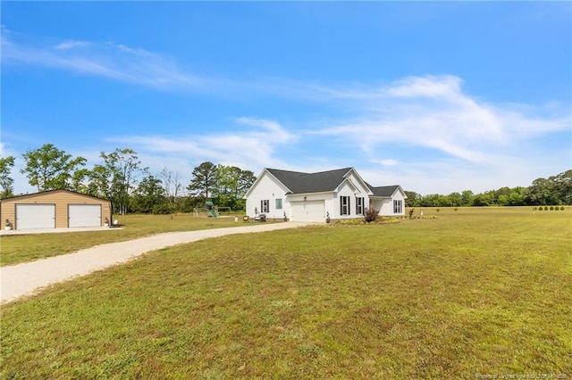 6955 S W St, Godwin, NC 28344 - modern farmhouse featuring driveway, a front yard, a garage, and an outdoor structure