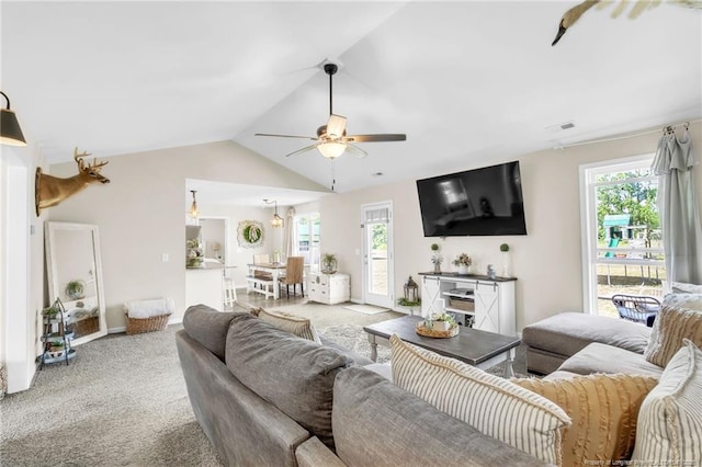 6955 S W St, Godwin, NC 28344 - living area with healthy amount of natural light, ceiling fan, lofted ceiling, light carpet, and baseboards