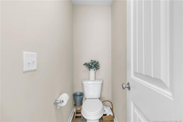 6955 S W St, Godwin, NC 28344 - bathroom featuring baseboards and toilet