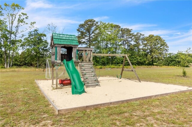 6955 S W St, Godwin, NC 28344 - view of jungle gym featuring a lawn