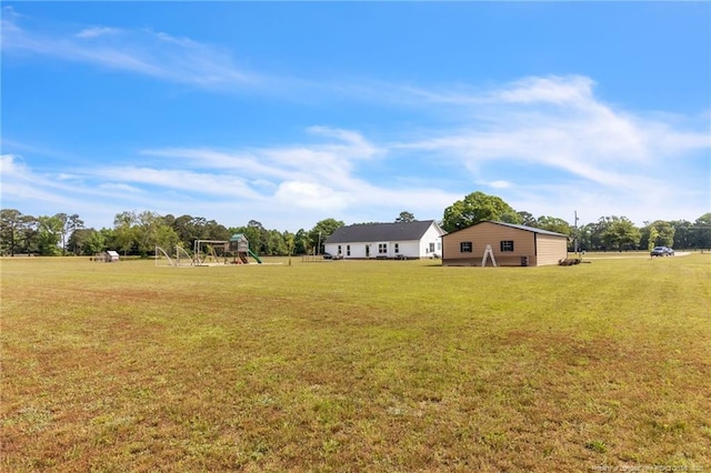 6955 S W St, Godwin, NC 28344 - view of green lawn featuring a playground