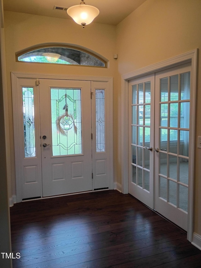 243 Nortwick Rd, Rolesville, NC 27571 - foyer entrance featuring french doors, dark wood-style flooring, and baseboards