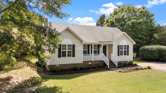 765 S Hollybrook Rd, Wendell, NC 27591 - ranch-style house with a porch, crawl space, a front lawn, and central air condition unit