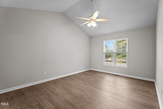 765 S Hollybrook Rd, Wendell, NC 27591 - empty room with ceiling fan, dark wood finished floors, lofted ceiling, and baseboards