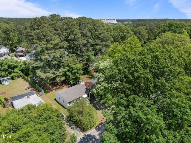 aerial view of property's location with a forest