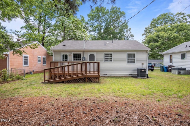 back of property with crawl space, a wooden deck, and central air condition unit