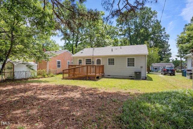 back of house featuring crawl space, a wooden deck, and cooling unit