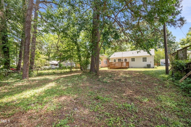 view of yard featuring a wooden deck