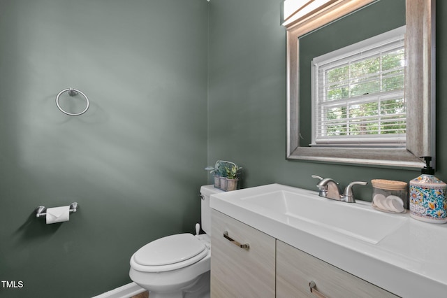 bathroom with toilet and vanity