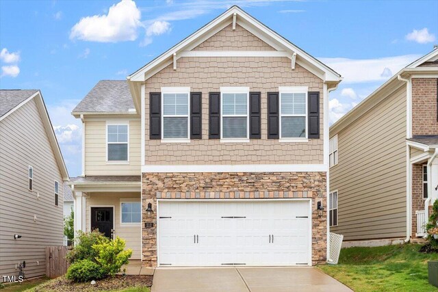 212 Sea Trail St, Hillsborough, NC 27278 - craftsman-style house featuring driveway, stone siding, and an attached garage