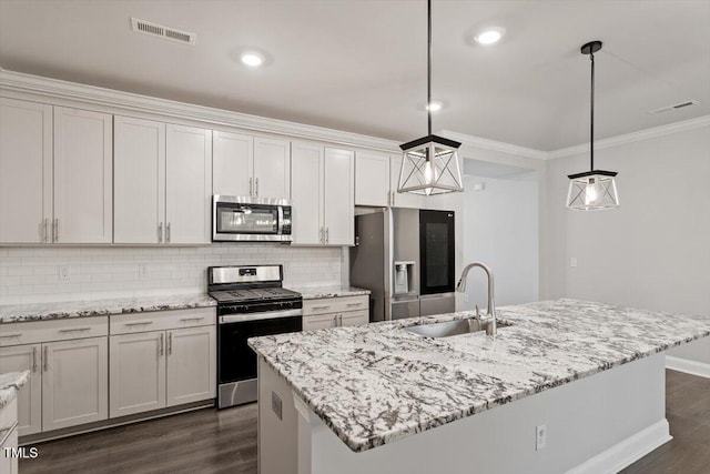 212 Sea Trail St, Hillsborough, NC 27278 - kitchen featuring appliances with stainless steel finishes, dark wood finished floors, crown molding, backsplash, and hanging light fixtures
