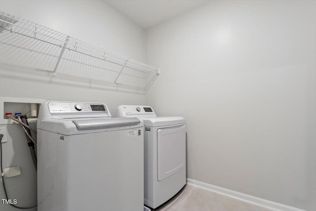 212 Sea Trail St, Hillsborough, NC 27278 - washroom featuring washing machine and dryer and light tile patterned flooring