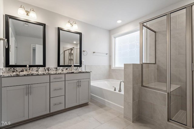 212 Sea Trail St, Hillsborough, NC 27278 - bathroom with double vanity, a bath, a shower stall, and tile patterned flooring
