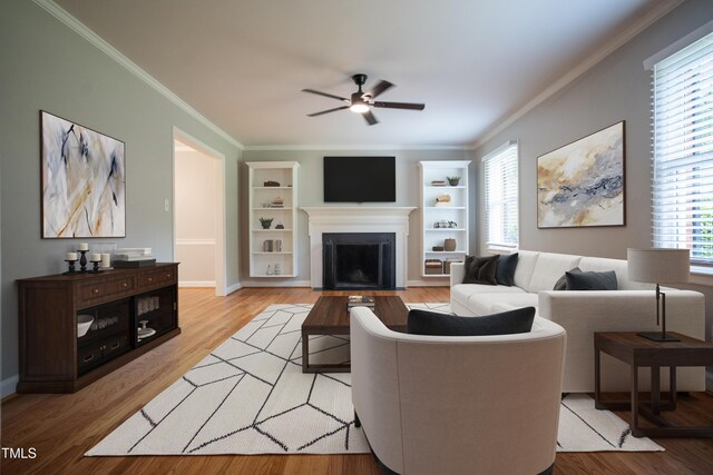 4813 Glen Forest Dr, Raleigh, NC 27612 - living area featuring a ceiling fan, crown molding, light wood finished floors, a fireplace with flush hearth, and built in shelves