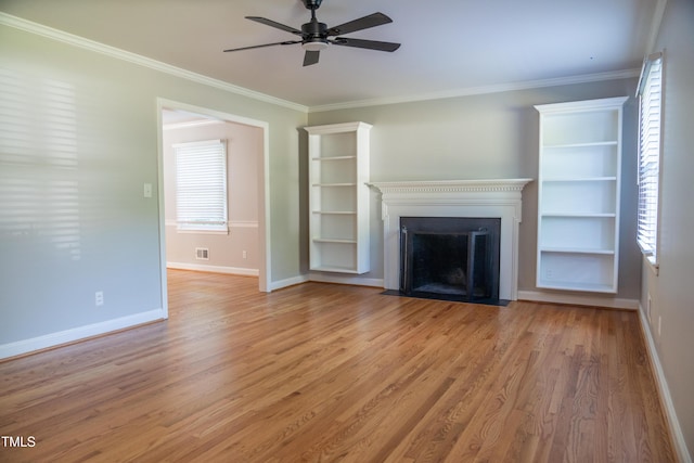 4813 Glen Forest Dr, Raleigh, NC 27612 - unfurnished living room featuring a ceiling fan, a fireplace with flush hearth, light wood-style flooring, ornamental molding, and baseboards