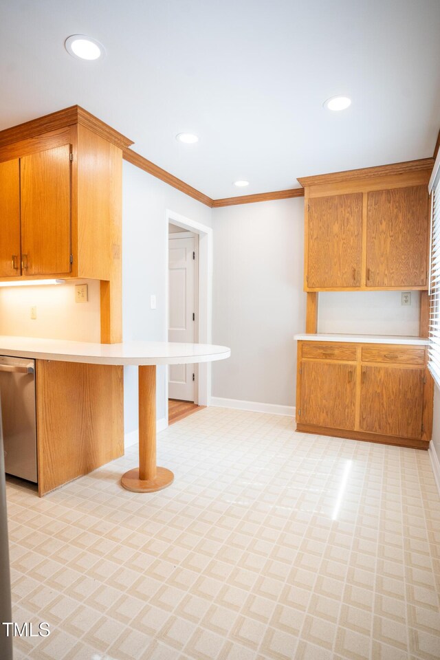 4813 Glen Forest Dr, Raleigh, NC 27612 - kitchen featuring stainless steel dishwasher, light countertops, baseboards, crown molding, and recessed lighting