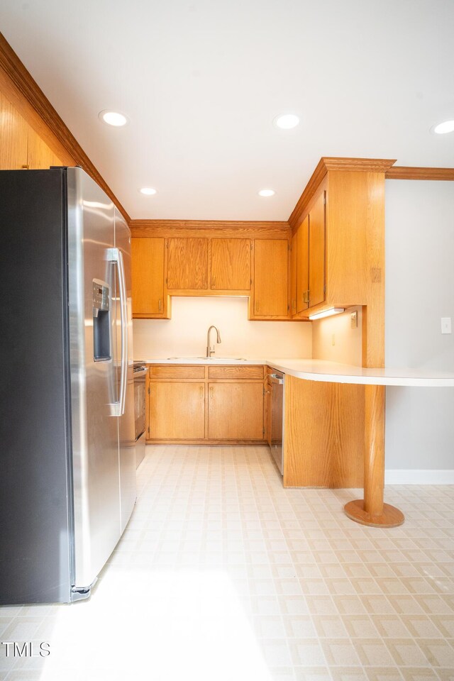 4813 Glen Forest Dr, Raleigh, NC 27612 - kitchen with stainless steel appliances, light flooring, light countertops, recessed lighting, and ornamental molding