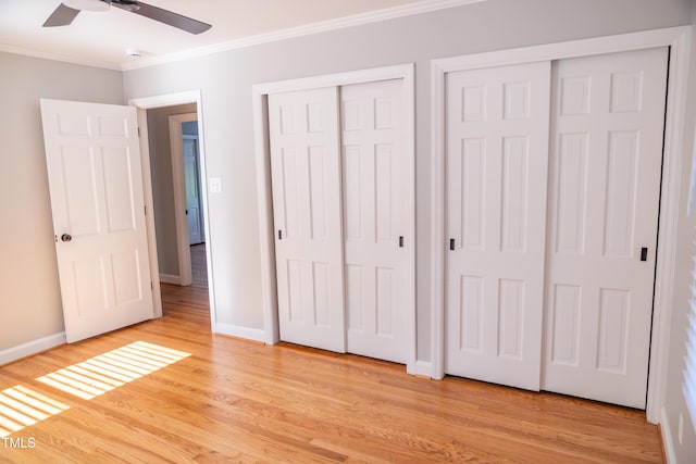 4813 Glen Forest Dr, Raleigh, NC 27612 - unfurnished bedroom featuring ornamental molding, multiple closets, light wood finished floors, baseboards, and ceiling fan