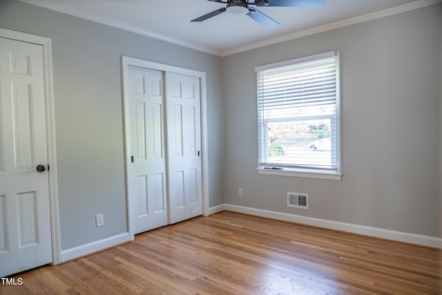 4813 Glen Forest Dr, Raleigh, NC 27612 - unfurnished bedroom featuring baseboards, light wood-style floors, crown molding, and ceiling fan