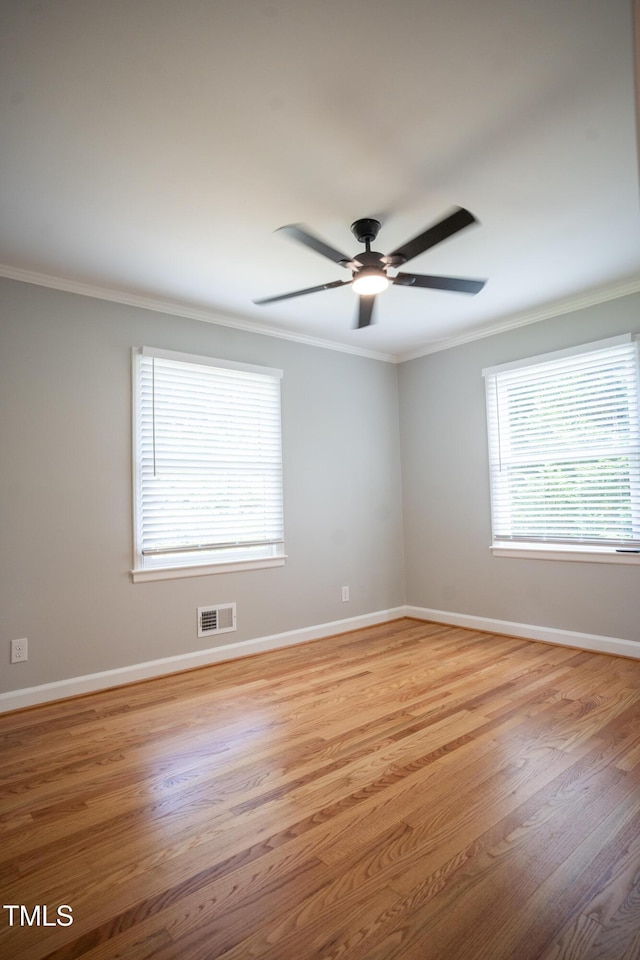 4813 Glen Forest Dr, Raleigh, NC 27612 - unfurnished room with ornamental molding, ceiling fan, light wood-type flooring, and baseboards