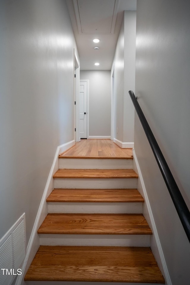 4813 Glen Forest Dr, Raleigh, NC 27612 - staircase featuring attic access, baseboards, recessed lighting, and wood finished floors