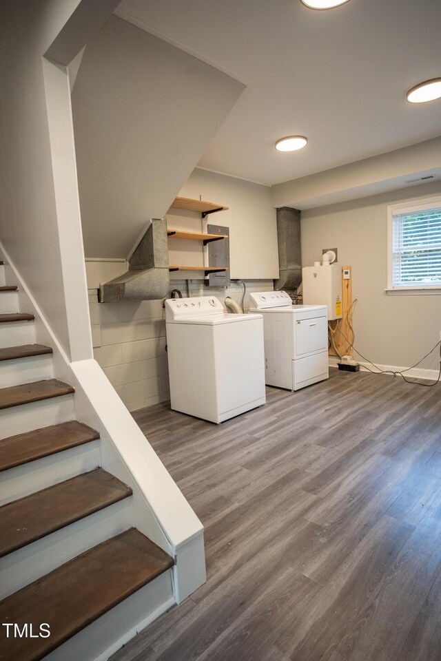 4813 Glen Forest Dr, Raleigh, NC 27612 - clothes washing area featuring washing machine and dryer and wood finished floors