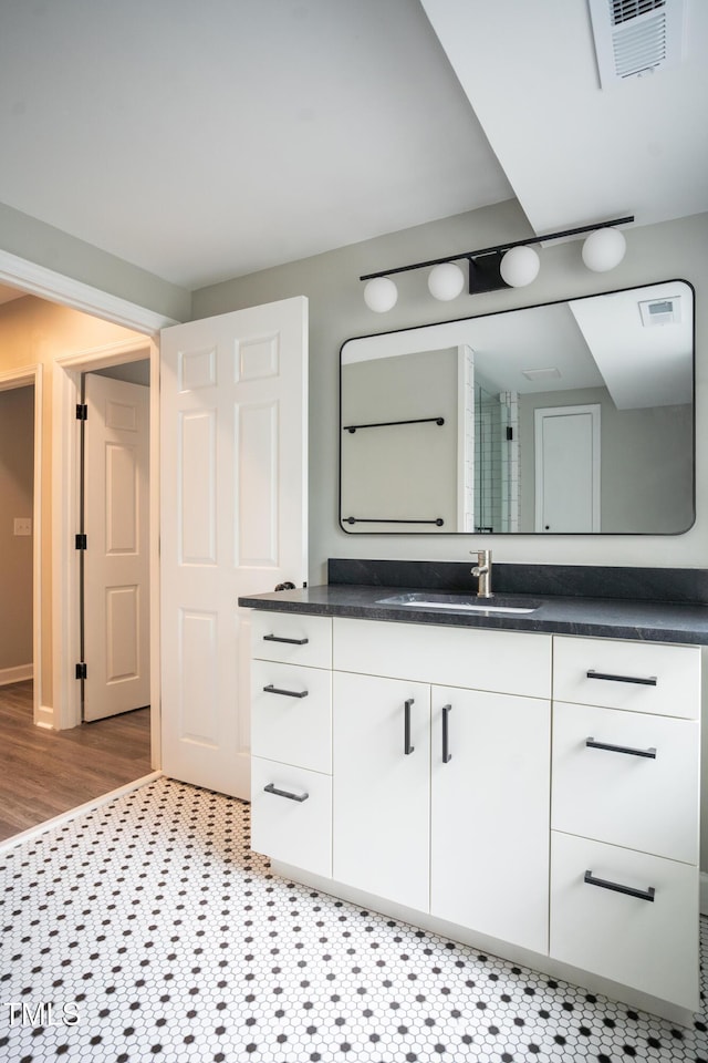 4813 Glen Forest Dr, Raleigh, NC 27612 - bathroom with vanity and wood finished floors