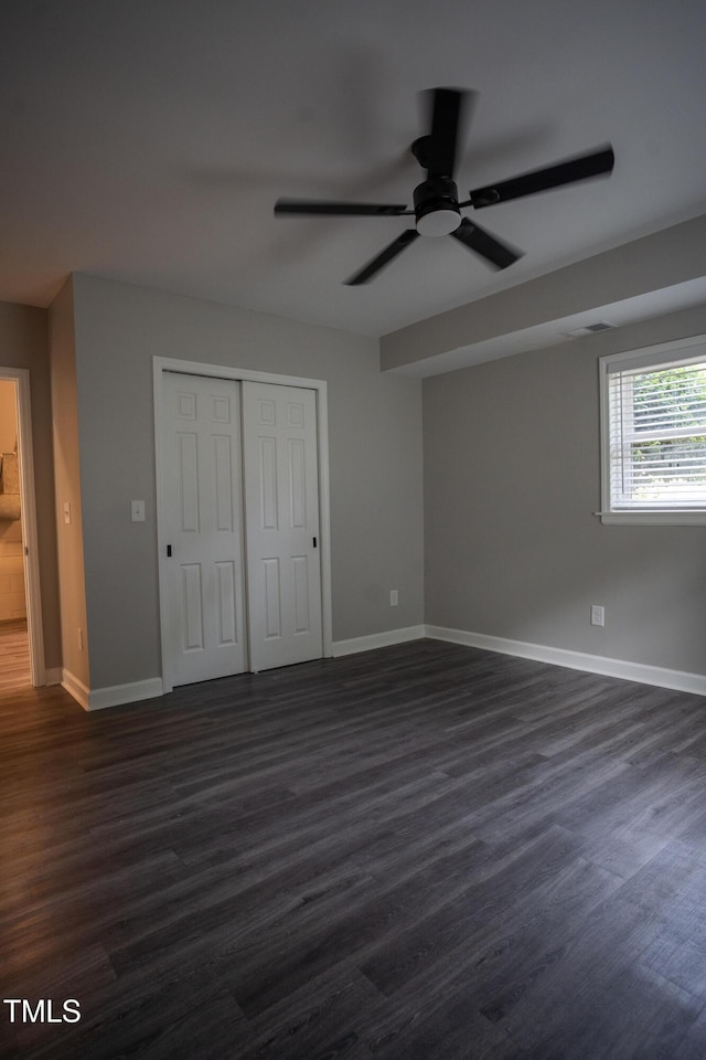 4813 Glen Forest Dr, Raleigh, NC 27612 - unfurnished bedroom with baseboards and dark wood-style flooring