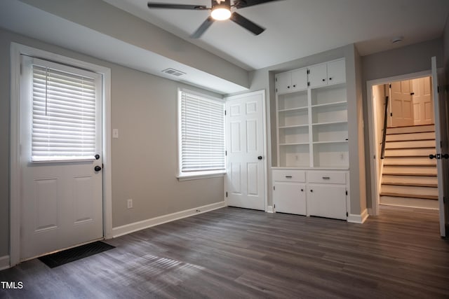 4813 Glen Forest Dr, Raleigh, NC 27612 - entryway with a ceiling fan, baseboards, dark wood-type flooring, and stairway