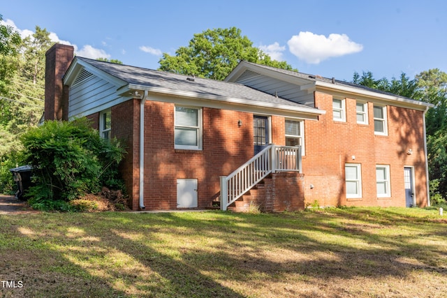 4813 Glen Forest Dr, Raleigh, NC 27612 - view of front of property featuring brick siding, a chimney, and a front lawn