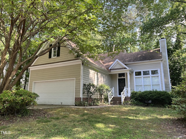 view of front of property with a chimney, a front lawn, and driveway
