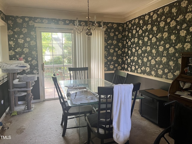 dining space featuring crown molding, wallpapered walls, a chandelier, carpet floors, and baseboards