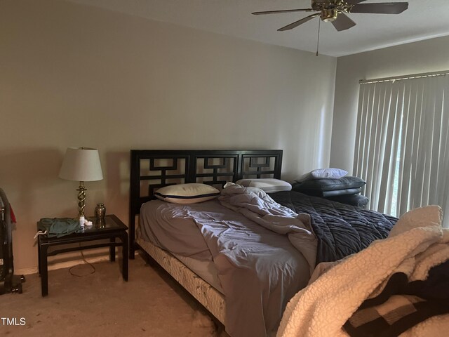 bedroom with carpet and a ceiling fan
