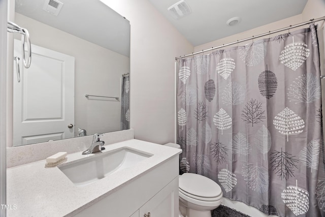 4157 Trevino Dr, Durham, NC 27704 - bathroom with toilet, vanity, and a shower with curtain