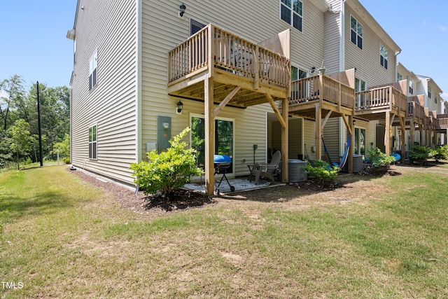 4157 Trevino Dr, Durham, NC 27704 - back of house featuring a yard, a deck, and a patio