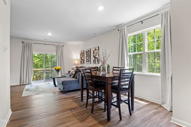 4157 Trevino Dr, Durham, NC 27704 - dining area with baseboards, wood finished floors, and recessed lighting