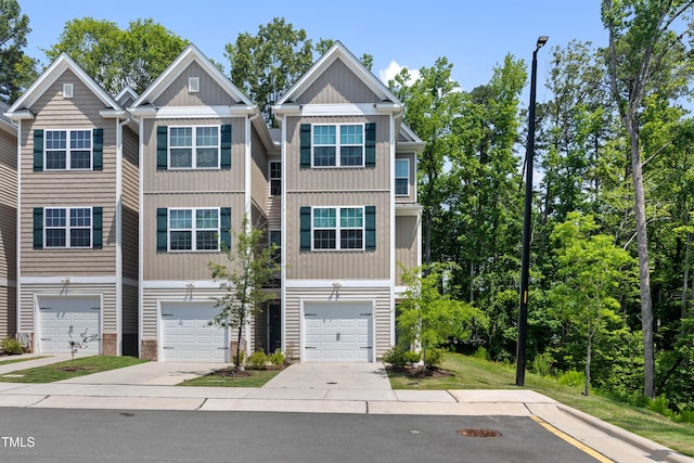 4157 Trevino Dr, Durham, NC 27704 - view of front of house featuring concrete driveway and a garage